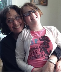 Photo: Gilda Guerrero with Sara Moss, one of her many extended children. Credit: Debbie Findling