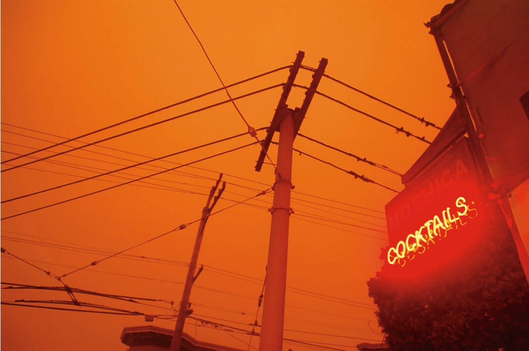 A blanket of wildfire smoke darkened skies, as seen at the corner of 18th and Connecticut streets. September 9, 2020, 9 a.m. Photo: Carmen Herraiz