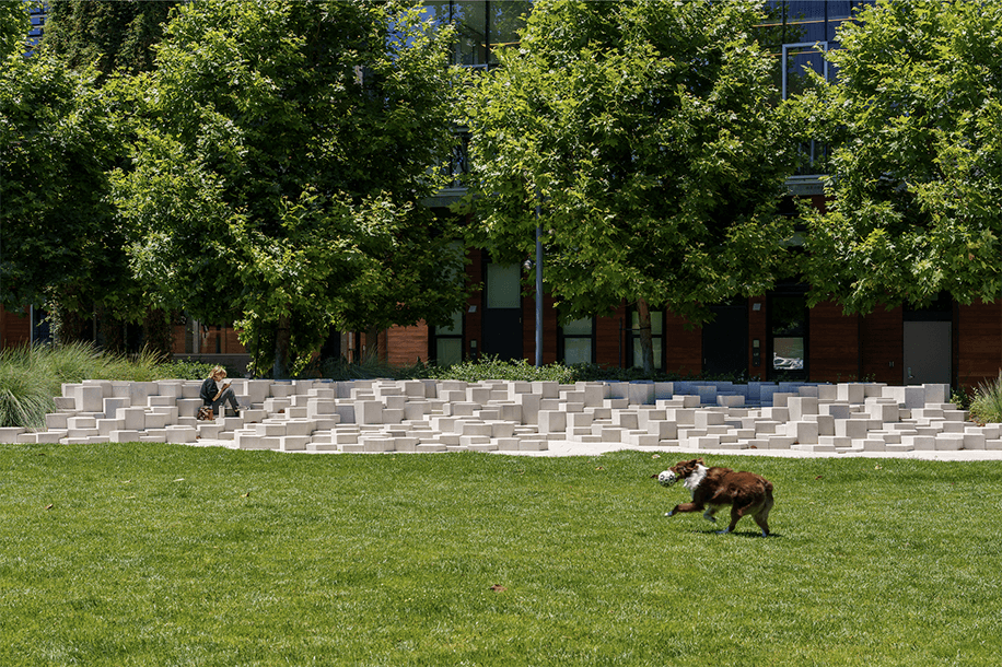 Photo: A neighbor enjoys lunch on the penta-step in Dagget Park. Although the park is public, private developers built and maintain it; the nonprofit Friends of Dagget Park manages it.