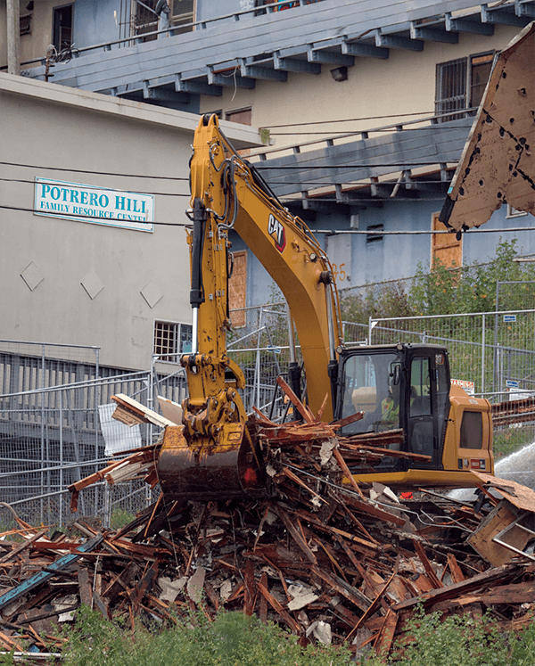 An excavator demolishes the first of 23 Potrero Annex buildings. Photo: Thomas Hunter II